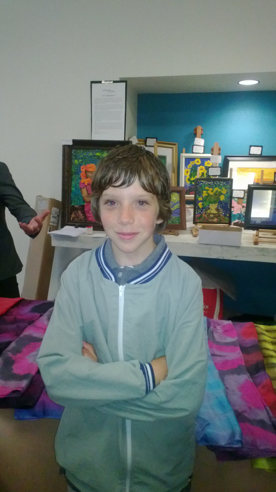 Aidan uses his artistic talents to help children in need by participating in the U.N. exhibit.
