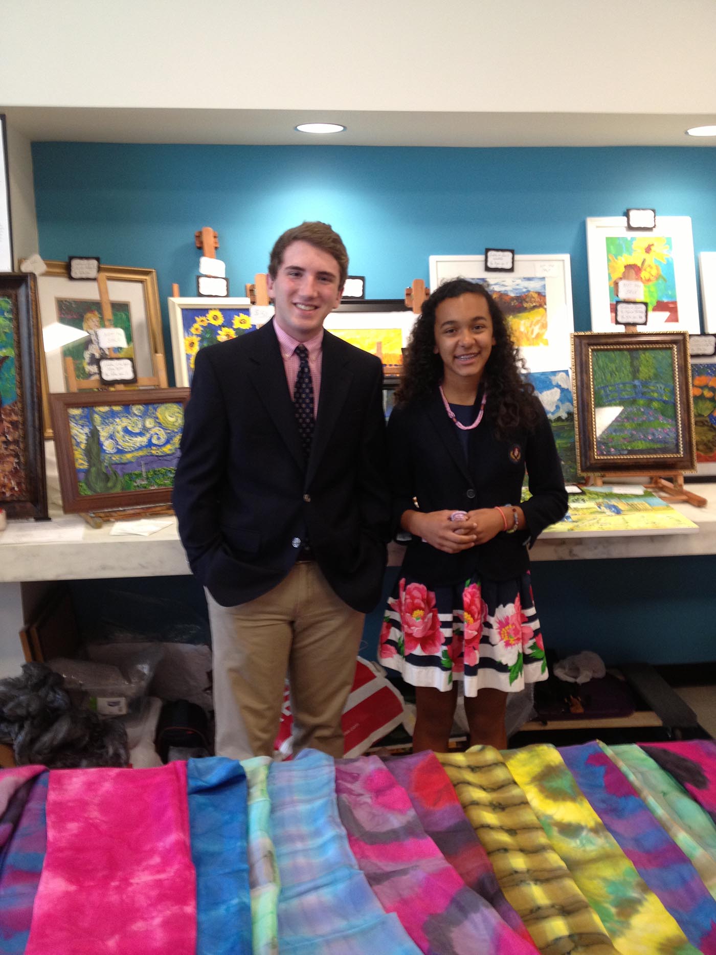 Tyler and Katie display their masterpieces at the United Nations Spouses Bazaar June 13, 2013