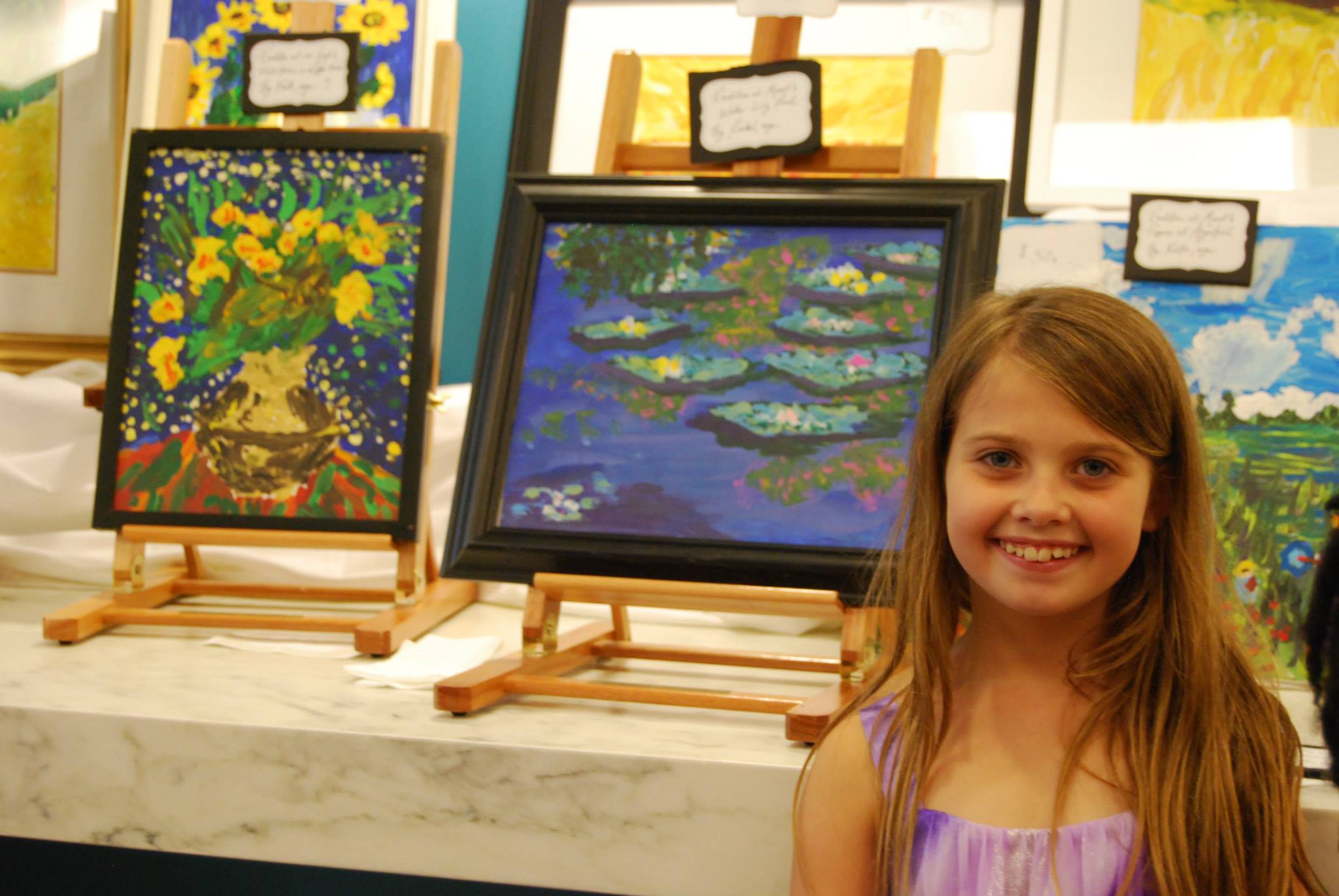Rachel enjoys seeing her masterpieces displayed at the United Nations building!  She felt honored to help other children